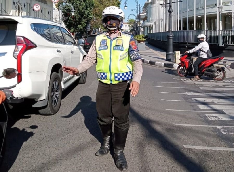 Aiptu Dadang Mashur saat bertugas.